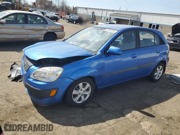 2009 Kia Rio LX with VIN KNADE243296500963, listed as a Copart auction lot 51061595 with 76,596 mi miles and Salvage Title. Bid and sale history available at carsss.com. Image 1.
