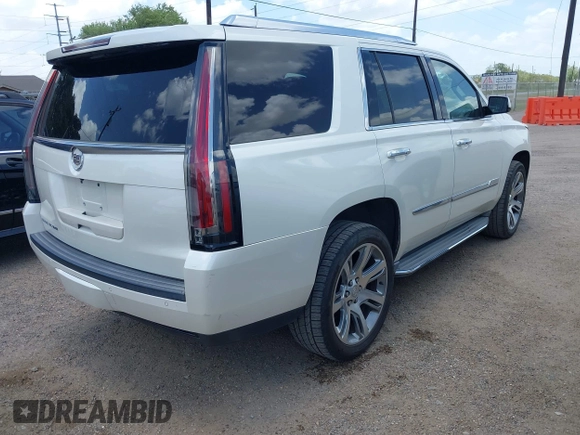 2015 Cadillac Escalade Luxury z VIN 1GYS4BKJ1FR215223, wystawiony jako IAAI lot #42548931 z przebiegiem 145 947 mil mil oraz . Historia ofert i sprzedaży dostępna na DreamBid. Obrazek 4.