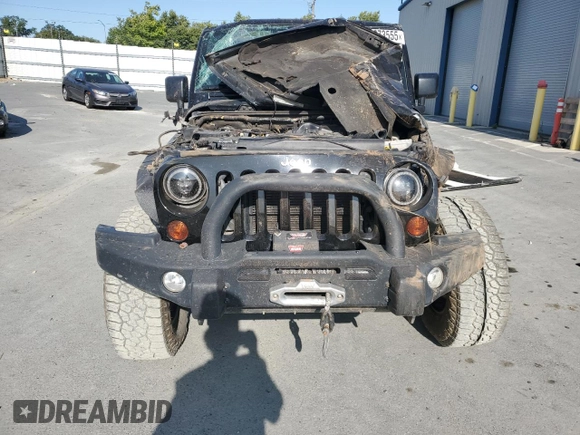 2012 Jeep Wrangler Unlimited Sahara with VIN 1C4BJWEG5CL235835, listed as a Copart auction lot 60673555 with 86,606 mi miles and Salvage title. Bid and sale history available at DreamBid. Image 5.