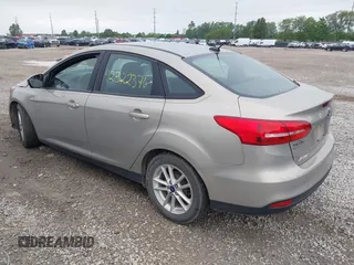 2016 Ford Focus SE z VIN 1FADP3F26GL368544, wystawiony jako IAAI lot #42322376 z przebiegiem 120 535 mil mil oraz . Historia ofert i sprzedaży dostępna na DreamBid. Obrazek 3.