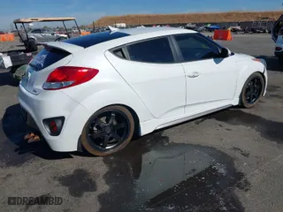 2014 Hyundai Veloster Turbo with VIN KMHTC6AE5EU201714, listed as a IAAI auction lot 40671069 with 151,901 mi miles. Bid and sale history available at carsss.com. Image 4.