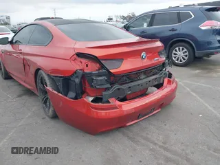 2013 BMW M6 z VIN WBSLX9C55DC968497, wystawiony jako IAAI lot #41863884 z przebiegiem 128 241 mil mil oraz . Historia ofert i sprzedaży dostępna na DreamBid. Obrazek 6.