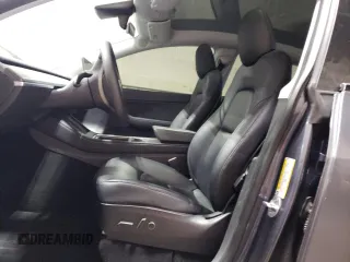 2021 Tesla Model Y Performance with VIN 5YJYGDEF2MF134700, listed as a Copart auction lot 56325685 with 66,730 mi miles and Salvage Title. Bid and sale history available at DreamBid. Image 7.