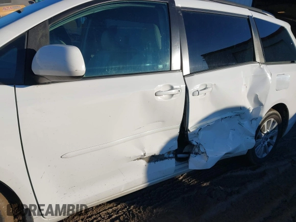 2012 Toyota Sienna XLE with VIN 5TDDK3DC4CS042464, listed as a IAAI auction lot 41199300 with 143,677 mi miles. Bid and sale history available at carsss.com. Image 6.