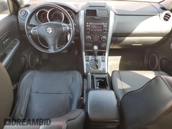2011 Suzuki Grand Vitara Limited z VIN JS3TE0D72B4100054, wystawiony jako Copart lot #52535705 z przebiegiem 131 468 mil mil oraz Szkoda całkowita • Salvage title. Historia ofert i sprzedaży dostępna na DreamBid. Obrazek 8.