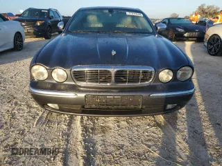 2004 Jaguar XJ with VIN SAJEA74C24SG09038, listed as a Copart auction lot 77015544 with Not Provided miles and Salvage Title. Bid and sale history available at DreamBid. Image 5.