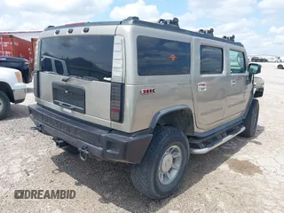 2003 Hummer H2 with VIN 5GRGN23U23H148326, listed as a IAAI auction lot 42068326 with 149,396 mi miles. Bid and sale history available at carsss.com. Image 4.