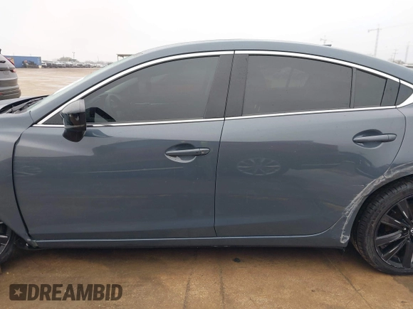 2021 Mazda 6 Carbon Edition with VIN JM1GL1WY0M1600414, listed as a IAAI auction lot 41551393 with 36,780 mi miles and . Bid and sale history available at DreamBid. Image 14.