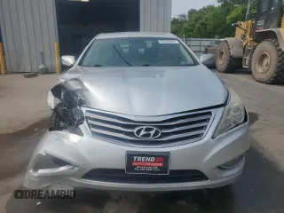 2013 Hyundai Azera с VIN KMHFG4JG5DA204636, выставлен на аукционе Copart как лот 59782945 с пробегом 74 494 миль миль и Списание • Salvage title. История ставок и продаж доступна на DreamBid. Изображение 5.