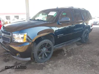 2007 Chevrolet Tahoe LS with VIN 1GNFC13C07J400472, listed as a IAAI auction lot 42209311 with 212,924 mi miles and . Bid and sale history available at DreamBid. Image 2.