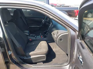 2014 Dodge Charger SXT Plus with VIN 2C3CDXJG0EH104680, listed as a IAAI auction lot 41784303 with 135,771 mi miles. Bid and sale history available at carsss.com. Image 5.