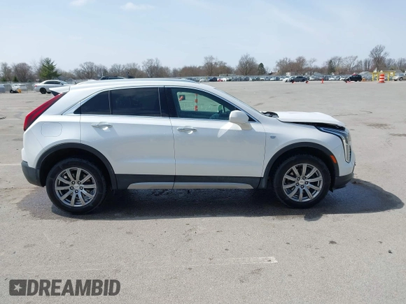 2020 Cadillac XT4 AWD Premium Luxury z VIN 1GYFZDR44LF036461, wystawiony jako IAAI lot #41934371 z przebiegiem 90 545 mil mil oraz . Historia ofert i sprzedaży dostępna na DreamBid. Obrazek 13.