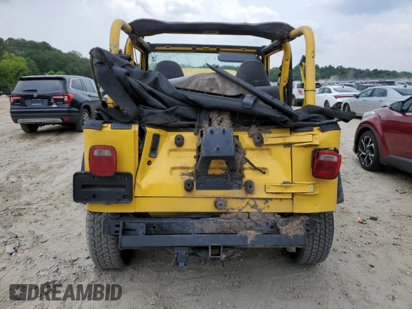 2000 Jeep Wrangler Sport with VIN 1J4FA49SXYP789791, listed as a Copart auction lot 60538875 with Not provided miles and Salvage title. Bid and sale history available at DreamBid. Image 6.