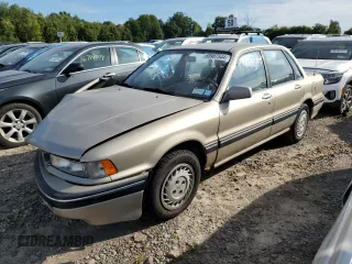 1989 Mitsubishi Galant with VIN JA3BR56V1KZ052149, listed as a Copart auction lot 69987544 with 74,232 mi miles and Salvage Title. Bid and sale history available at DreamBid. Image 1.