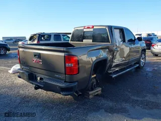 2015 GMC Sierra 1500 Denali with VIN 3GTU2WEC9FG355576, listed as a IAAI auction lot 41151606 with 115,017 mi miles. Bid and sale history available at carsss.com. Image 4.