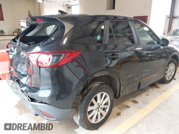 2016 Mazda CX-5 Touring with VIN JM3KE2CY7G0867355, listed as a IAAI auction lot 41963169 with 117,727 mi miles and . Bid and sale history available at DreamBid. Image 4.