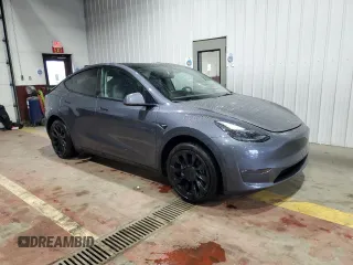 2023 Tesla Model Y Long Range z VIN 7SAYGDEE8PF814874, wystawiony jako Copart lot #56546365 z przebiegiem 20 919 mil mil oraz Szkoda całkowita • Salvage title. Historia ofert i sprzedaży dostępna na DreamBid. Obrazek 4.