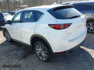 2020 Mazda CX-5 Grand Touring with VIN JM3KFADM3L1829208, listed as a IAAI auction lot 41684454 with 74,980 mi miles. Bid and sale history available at carsss.com. Image 3.