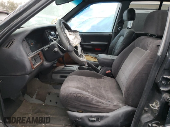 1998 Jeep Grand Cherokee Laredo with VIN 1J4FX58S4WC102623, listed as a Copart auction lot 86188764 with 283,210 mi miles and Salvage Title. Bid and sale history available at carsss.com. Image 7.