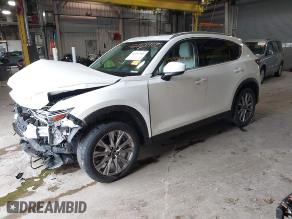 2020 Mazda CX-5 Grand Touring with VIN JM3KFADMXL0742038, listed as a IAAI auction lot 42292400 with 68,339 mi miles and . Bid and sale history available at DreamBid. Image 23.