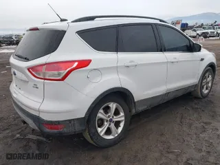 2015 Ford Escape SE with VIN 1FMCU9GX8FUC80918, listed as a IAAI auction lot 41694880 with 182,929 mi miles. Bid and sale history available at carsss.com. Image 4.