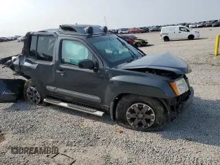 2015 Nissan Xterra Pro-4X z VIN 5N1AN0NWXFN664591, wystawiony jako Copart lot #60423525 z przebiegiem 246 477 mil mil oraz Szkoda całkowita • Salvage title. Historia ofert i sprzedaży dostępna na DreamBid. Obrazek 4.