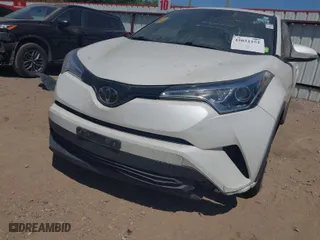 2019 Toyota C-HR XLE with VIN JTNKHMBX7K1023674, listed as a IAAI auction lot 42021152 with 106,450 mi miles. Bid and sale history available at carsss.com. Image 6.