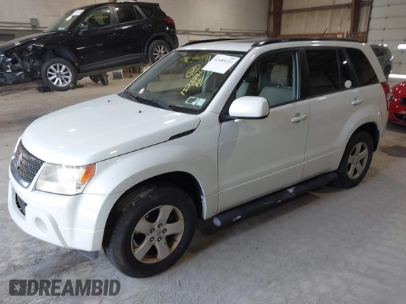 2009 Suzuki Grand Vitara z VIN JS3TD044294100168, wystawiony jako IAAI lot #42489252 z przebiegiem 152 679 mil mil oraz . Historia ofert i sprzedaży dostępna na DreamBid. Obrazek 2.