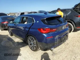 2021 BMW X2 sDrive28i with VIN WBXYH9C02M5S54591, listed as a Copart auction lot 77223834 with 0 mi miles and Salvage Title. Bid and sale history available at carsss.com. Image 2.