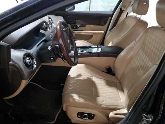 2016 Jaguar XJ with VIN SAJXJ1GD2G8V98776, listed as a Copart auction lot 41959995 with 77,391 mi miles and Salvage title. Bid and sale history available at DreamBid. Image 7.