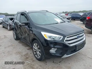 2017 Ford Escape Titanium with VIN 1FMCU0J93HUF10664, listed as a IAAI auction lot 41921588 with 88,377 mi miles. Bid and sale history available at carsss.com. Image 1.