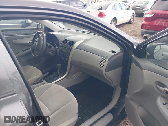 2009 Toyota Corolla with VIN JTDBL40E799040751, listed as a IAAI auction lot 42046821 with 199,634 mi miles. Bid and sale history available at carsss.com. Image 5.