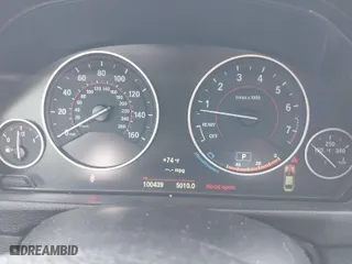 2015 BMW 4 Series 428i xDrive with VIN WBA3N5C55FK484938, listed as a IAAI auction lot 41889907 with 100,439 mi miles. Bid and sale history available at carsss.com. Image 7.