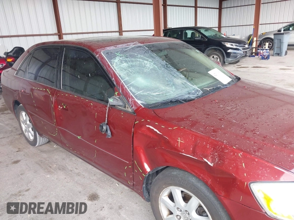 2000 Toyota Avalon XL z VIN 4T1BF28B7YU005222, wystawiony jako IAAI lot #42310903 z przebiegiem 118 700 mil mil oraz . Historia ofert i sprzedaży dostępna na DreamBid. Obrazek 6.