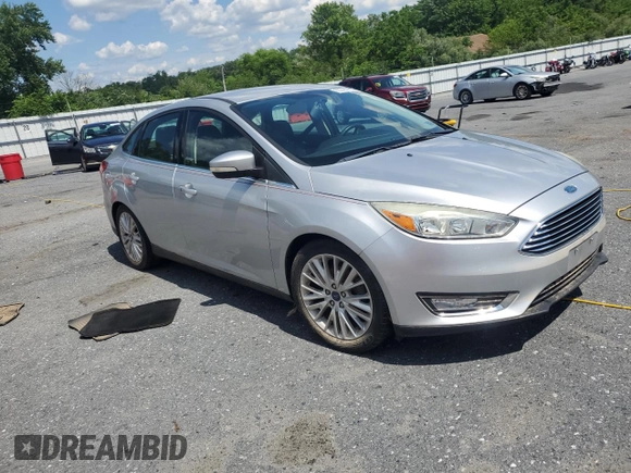 2015 Ford Focus Titanium with VIN 1FADP3J27FL267339, listed as a Copart auction lot 63395835 with 73,372 mi miles and Salvage title. Bid and sale history available at DreamBid. Image 4.