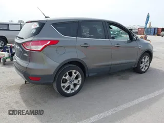 2013 Ford Escape SEL with VIN 1FMCU0HX5DUB82534, listed as a IAAI auction lot 41769014 with 182,433 mi miles. Bid and sale history available at carsss.com. Image 4.