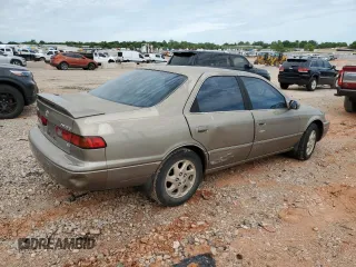 1999 Toyota Camry LE z VIN JT2BF28K9X0199531, wystawiony jako Copart lot #55637275 z przebiegiem Nie podano mil oraz Szkoda całkowita • Salvage title. Historia ofert i sprzedaży dostępna na DreamBid. Obrazek 3.