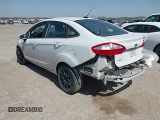 2016 Ford Fiesta SE with VIN 3FADP4BJ7GM175966, listed as a IAAI auction lot 41821964 with 100,375 mi miles. Bid and sale history available at carsss.com. Image 3.