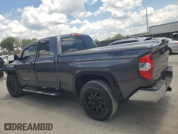 2019 Toyota Tundra SR with VIN 5TFRM5F13KX141745, listed as a Copart auction lot 56910955 with 67,856 mi miles and Salvage title. Bid and sale history available at DreamBid. Image 2.