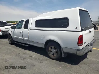 2003 Ford F-150 XL with VIN 2FTRX17L23CA17128, listed as a Copart auction lot 60144965 with 121,055 mi miles and Salvage title. Bid and sale history available at DreamBid. Image 2.