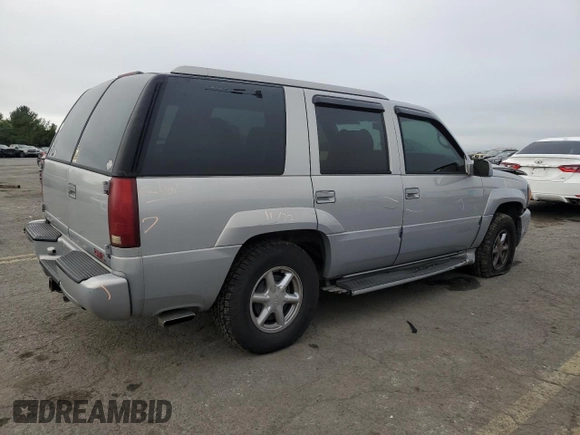 2000 GMC Denali z VIN 1GKEK13RXYR110436, wystawiony jako Copart lot #74311244 z przebiegiem 250 735 mil mil oraz Szkody całkowita. Historia ofert i sprzedaży dostępna na DreamBid. Obrazek 3.