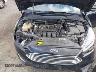 2016 Ford Focus Titanium z VIN 1FADP3J27GL215436, wystawiony jako IAAI lot #42709166 z przebiegiem 75 956 mil mil oraz . Historia ofert i sprzedaży dostępna na DreamBid. Obrazek 10.