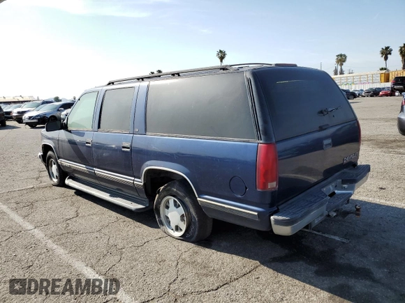 1999 Chevrolet Suburban with VIN 3GNEC16RXXG254126, listed as a Copart auction lot 52051405 with 113,554 mi miles and Clean title. Bid and sale history available at DreamBid. Image 2.