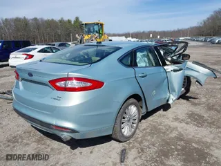 2014 Ford Fusion SE Hybrid with VIN 3FA6P0LU0ER304804, listed as a IAAI auction lot 41817607 with 202,590 mi miles. Bid and sale history available at carsss.com. Image 4.