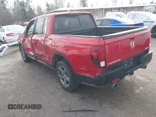 2022 Honda Ridgeline RTL-E with VIN 5FPYK3F74NB011358, listed as a IAAI auction lot 41431157 with 26,116 mi miles and . Bid and sale history available at DreamBid. Image 3.
