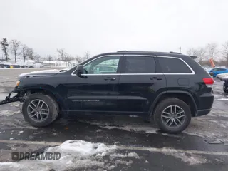 2019 Jeep Grand Cherokee Laredo E with VIN 1C4RJFAGXKC834233, listed as a IAAI auction lot 41392437 with 81,005 mi miles. Bid and sale history available at carsss.com. Image 15.