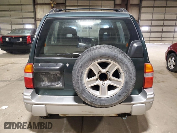 2002 Chevrolet Tracker LT z VIN 2CNBJ634126949974, wystawiony jako Copart lot #54819695 z przebiegiem 200 895 mil mil oraz Szkoda całkowita • Salvage title. Historia ofert i sprzedaży dostępna na DreamBid. Obrazek 6.