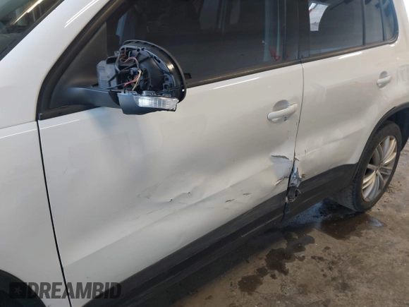 2013 Volkswagen Tiguan with VIN WVGCV3AX7DW605594, listed as a IAAI auction lot 42057457 with 131,629 mi miles and . Bid and sale history available at DreamBid. Image 6.