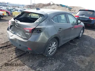 2014 Mazda 3 i Grand Touring with VIN JM1BM1M75E1207754, listed as a IAAI auction lot 41698583 with 128,887 mi miles and . Bid and sale history available at DreamBid. Image 4.