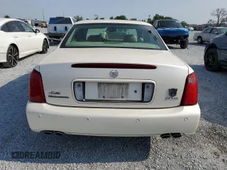 2003 Cadillac DeVille DTS z VIN 1G6KF57933U147843, wystawiony jako Copart lot #55875195 z przebiegiem 160 814 mil mil oraz Szkody całkowita. Historia ofert i sprzedaży dostępna na DreamBid. Obrazek 6.